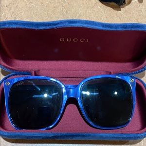 Blue Gucci fun and glasses.